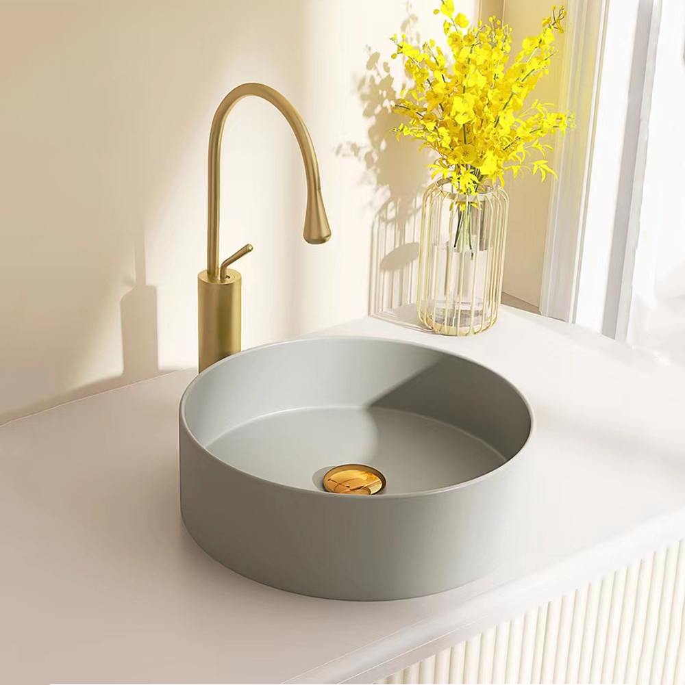 Lavandino da bagno rotondo bianco in stile semplice all'ingrosso in ceramica sopra il lavabo da appoggio per lavabo artistico per la casa