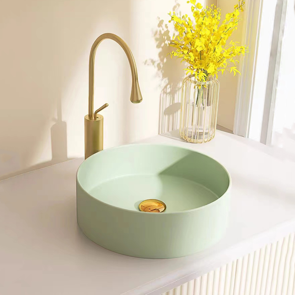 Lavandino da bagno rotondo bianco in stile semplice all'ingrosso in ceramica sopra il lavabo da appoggio per lavabo artistico per la casa